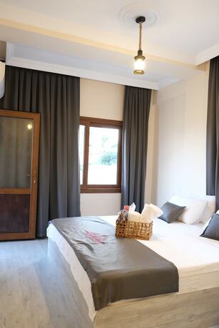 Imagen de la habitación del Tek Han Kumkuyu Hotel. Foto 17