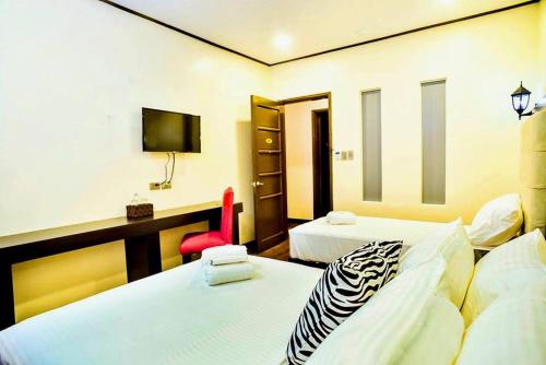 Imagen de la habitación del The Ambassador Hotel. Foto 6