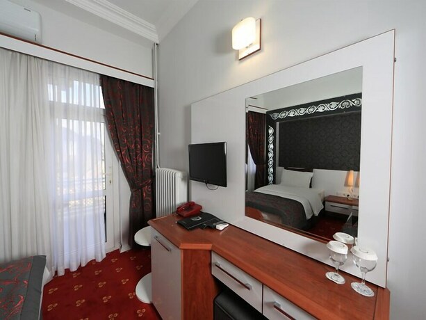 Imagen de la habitación del The Apple Palace. Foto 24