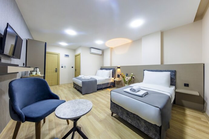 Imagen de la habitación del The Business Class Hotel. Foto 11
