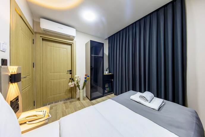 Imagen de la habitación del The Business Class Hotel. Foto 12
