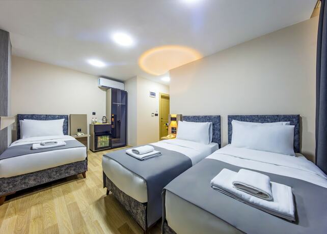 Imagen de la habitación del The Business Class Hotel. Foto 14