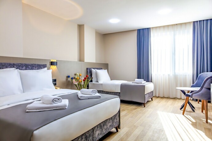 Imagen de la habitación del The Business Class Hotel. Foto 19