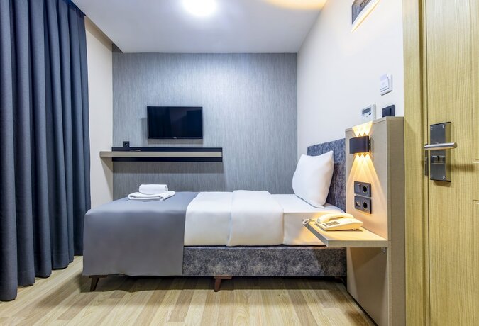 Imagen de la habitación del The Business Class Hotel. Foto 20