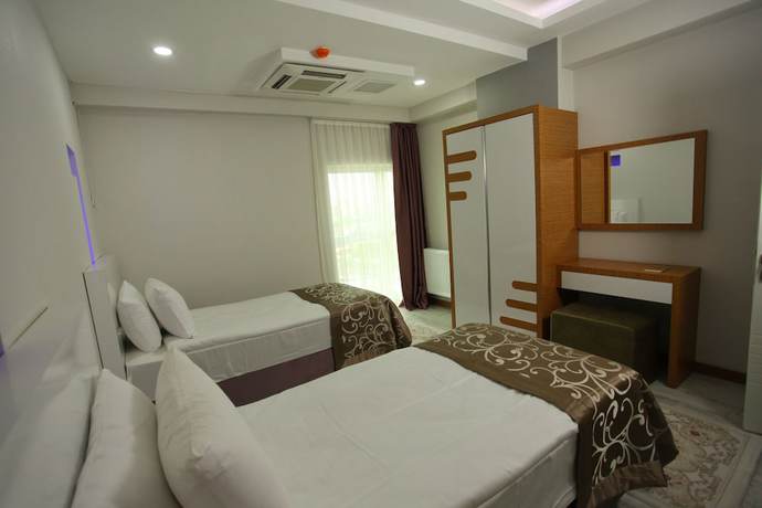 Imagen de la habitación del The City Walls Suit Hotel. Foto 13