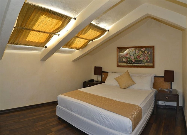 Imagen de la habitación del The Colony Hotel. Foto 3