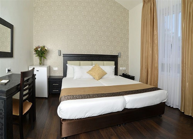 Imagen de la habitación del The Colony Hotel. Foto 6
