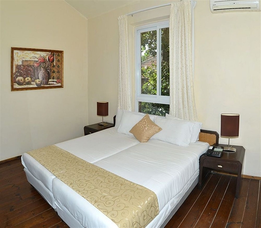 Imagen de la habitación del The Colony Hotel. Foto 10