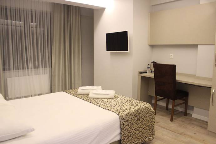 Imagen de la habitación del The Corner Inn Hotel Suit. Foto 3