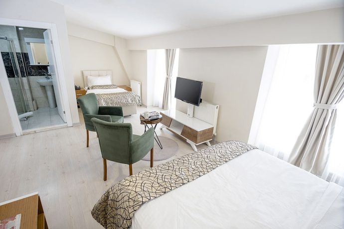 Imagen de la habitación del The Corner Inn Hotel Suit. Foto 7