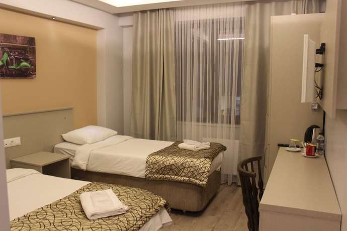 Imagen de la habitación del The Corner Inn Hotel Suit. Foto 13