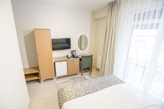 Imagen de la habitación del The Corner Inn Hotel Suit. Foto 15