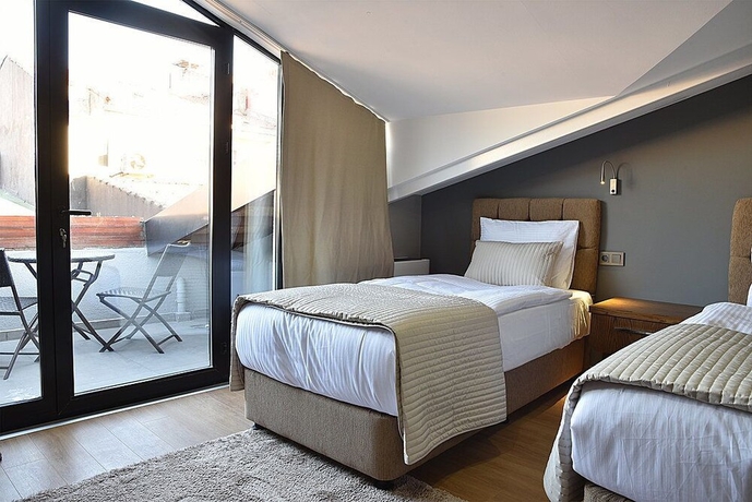 Imagen de la habitación del The Elegant Hotel. Foto 8