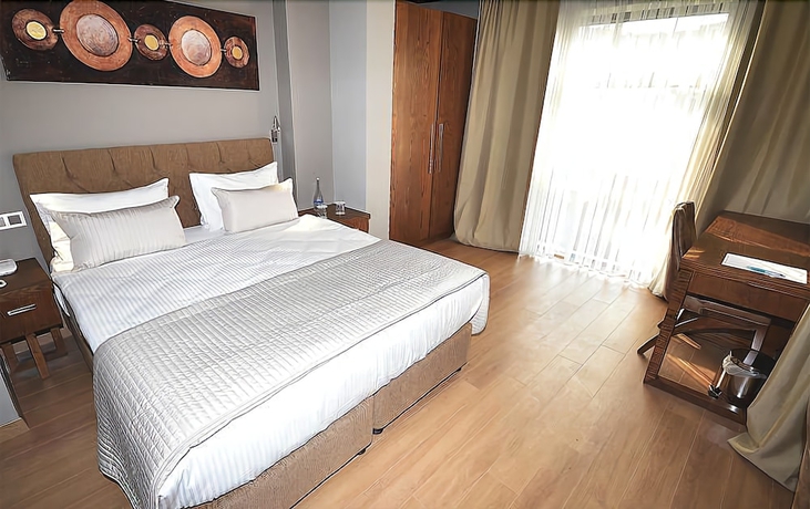 Imagen de la habitación del The Elegant Hotel. Foto 9