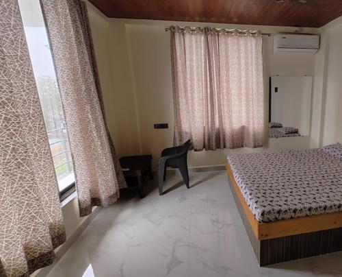 Imagen de la habitación del The Exotic Farmhouse Nala Sopara. Foto 13