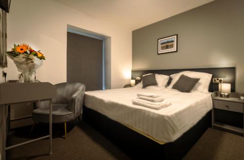 Imagen de la habitación del The Friendship Hotel. Foto 12