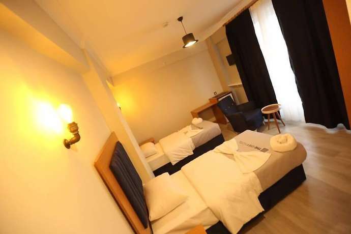 Imagen de la habitación del The Grey Hotel. Foto 10