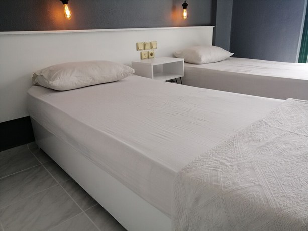 Imagen de la habitación del The Mu Hotel. Foto 13