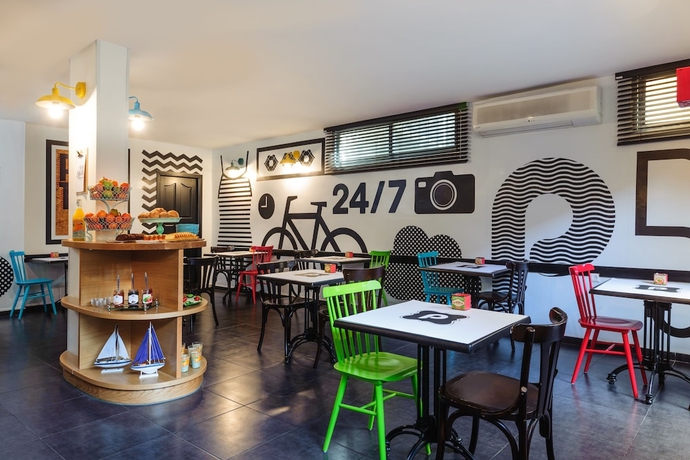 Imagen del bar/restaurante del The New Port Hotel Tel Aviv. Foto 4