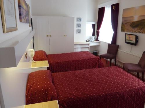 Imagen de la habitación del The Regal Hotel. Foto 8