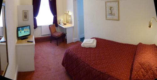 Imagen de la habitación del The Regal Hotel. Foto 9