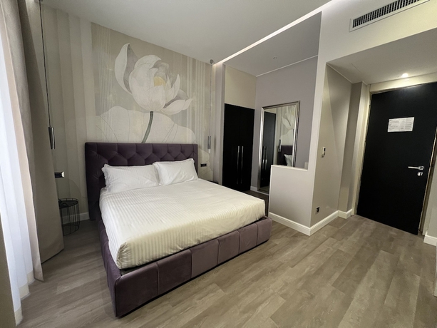 Imagen de la habitación del The Unique Hotel. Foto 2