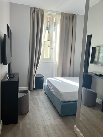 Imagen de la habitación del The Unique Hotel. Foto 5