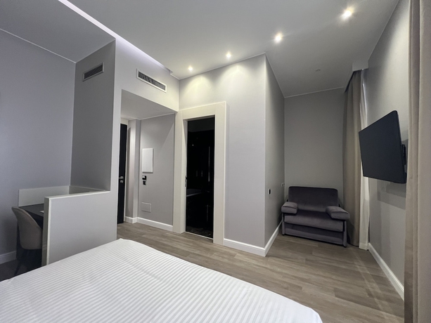 Imagen de la habitación del The Unique Hotel. Foto 14