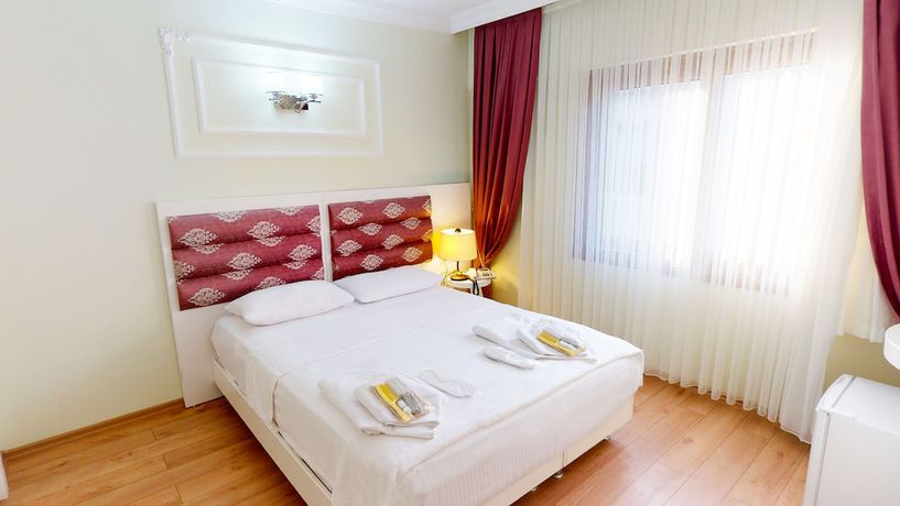 Imagen de la habitación del The Wolf Hotel. Foto 7