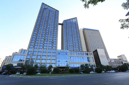Imagen de la habitación del Tianjin Tanggu Ruiwan International Apartment. Foto 8