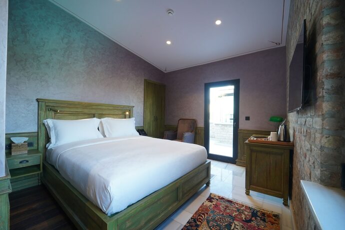 Imagen de la habitación del Tin Suites. Foto 15