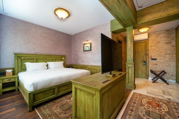 Imagen de la habitación del Tin Suites. Foto 16