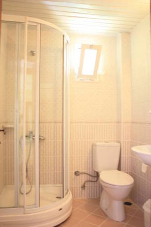 Imagen de la habitación del Toloman Hotel & Apartments. Foto 1