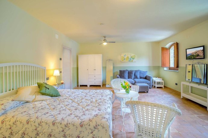 Imagen de la habitación del Torrenova di Assisi Country House. Foto 15