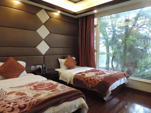 Imagen de la habitación del Towo Toppin Hotel Emeishan Linggongli. Foto 3