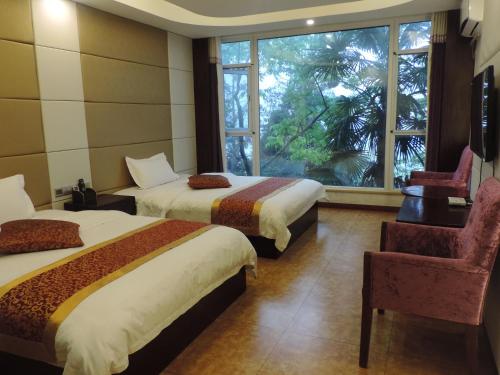 Imagen de la habitación del Towo Toppin Hotel Emeishan Linggongli. Foto 4