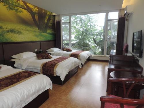Imagen de la habitación del Towo Toppin Hotel Emeishan Linggongli. Foto 5