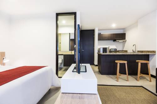 Imagen de la habitación del Travelers Rio Verde Living Suites. Foto 3