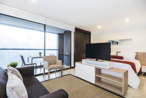 Imagen de la habitación del Travelers Rio Verde Living Suites. Foto 6