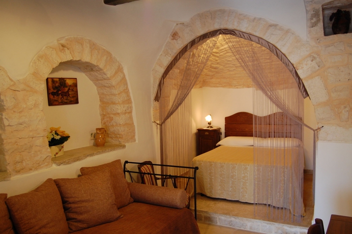 Imagen de la habitación del Trulli Holiday Albergo Diffuso. Foto 5