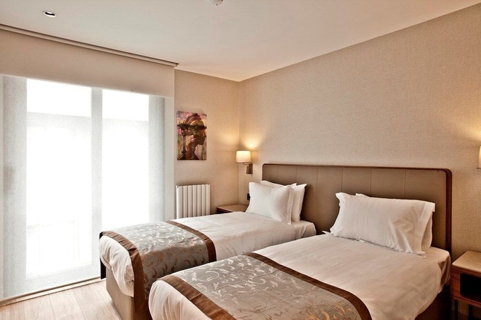 Imagen de la habitación del Tzl Suites. Foto 10