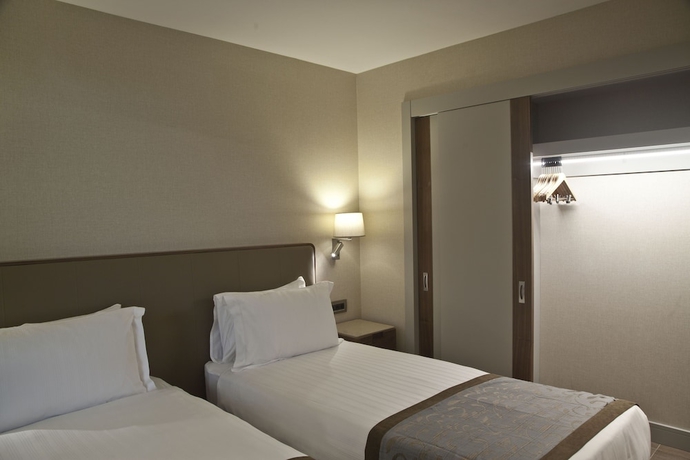 Imagen de la habitación del Tzl Suites. Foto 16