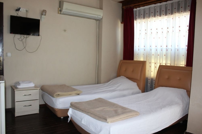Imagen de la habitación del Urla Tarihi Han Otel. Foto 10