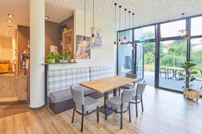 Imagen del bar/restaurante del VR-Serviced Apartments Obergeis. Foto 3