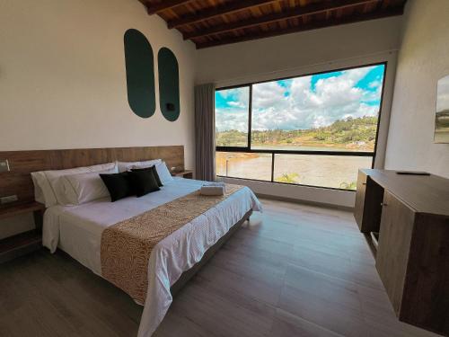 Imagen de la habitación del Viajero Guatap&eacute; Hostel. Foto 13