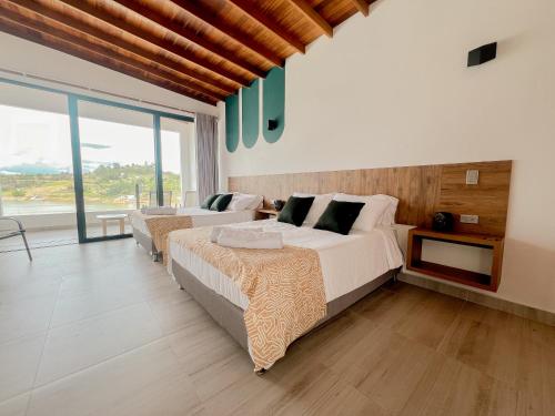 Imagen de la habitación del Viajero Guatap&eacute; Hostel. Foto 17