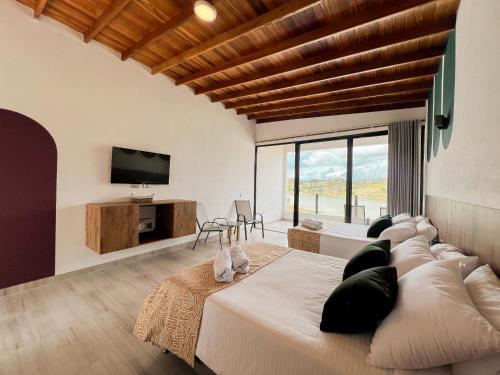 Imagen de la habitación del Viajero Guatap&eacute; Hostel. Foto 18