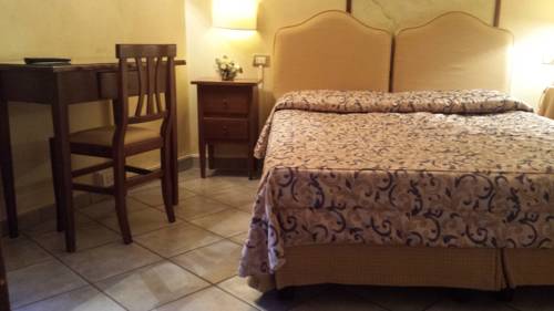 Imagen de la habitación del Villa Le Camelie Siena. Foto 3