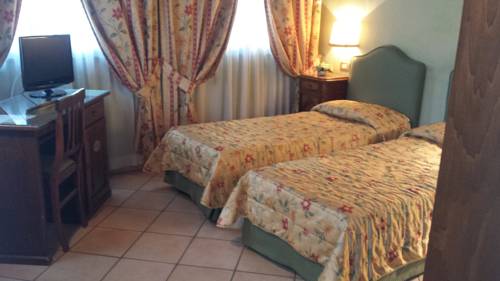 Imagen de la habitación del Villa Le Camelie Siena. Foto 5