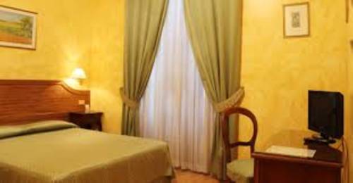 Imagen de la habitación del Villa Le Camelie Siena. Foto 9